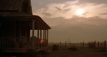 Movie still from “Secondhand Lions” (2003), directed by Tim McCanlies – An old abandoned house in the middle of a field; Extreme Wide shot, Low angle