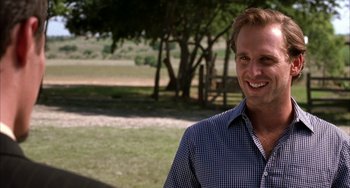 Movie still from “Secondhand Lions” (2003), directed by Tim McCanlies – A man smiling for the camera while standing in a field; Close Up shot, Over the shoulder angle