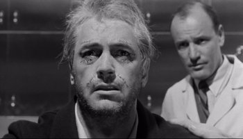 Movie still from “Seconds” (1966), directed by John Frankenheimer – A black and white photo of a man with a beard; Close Up shot, Low angle