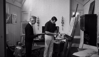 Movie still from “Seconds” (1966), directed by John Frankenheimer – Two men are working in an artist's studio; Medium shot, Low angle