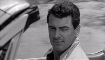 Movie still from “Seconds” (1966), directed by John Frankenheimer – Black and white photograph of a man in a white shirt; Close Up shot, Low angle