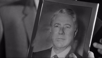 Movie still from “Seconds” (1966), directed by John Frankenheimer – A black and white photo of a man in a suit; Close Up shot, Low angle