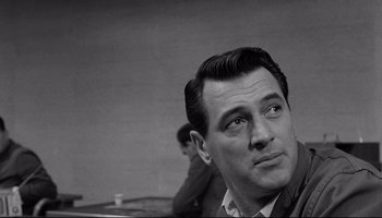 Movie still from “Seconds” (1966), directed by John Frankenheimer – Black and white photograph of a man looking up; Close Up shot, Over the shoulder angle