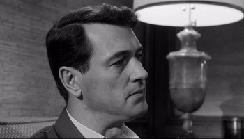 Movie still from “Seconds” (1966), directed by John Frankenheimer – Black and white photograph of a man in a suit; Close Up shot, Low angle