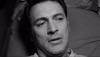 Movie still from “Seconds” (1966), directed by John Frankenheimer – Black and white photograph of a man's face; Close Up shot, Overhead angle