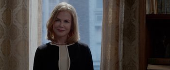 Movie still from “Secret in Their Eyes” (2015), directed by Billy Ray – A woman with blonde hair wearing a black and white dress; Close Up shot, Over the shoulder angle