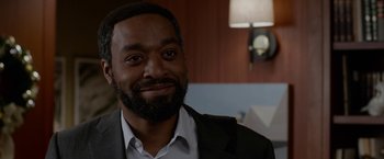 Movie still from “Secret in Their Eyes” (2015), directed by Billy Ray – A person wearing a suit and tie; Close Up shot, Over the shoulder angle