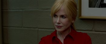 Movie still from “Secret in Their Eyes” (2015), directed by Billy Ray – A person wearing a red shirt; Close Up shot, Over the shoulder angle