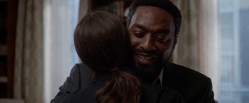 Movie still from “Secret in Their Eyes” (2015), directed by Billy Ray – A man and a woman hugging each other in front of a mirror; Close Up shot, Over the shoulder angle