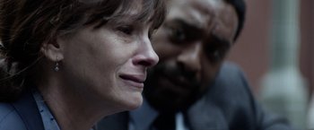 Movie still from “Secret in Their Eyes” (2015), directed by Billy Ray – A woman and a man looking at one another; Extreme Close Up shot, Over the shoulder angle