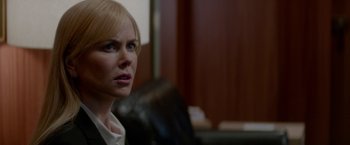 Movie still from “Secret in Their Eyes” (2015), directed by Billy Ray – A person sitting in a chair; Close Up shot, Over the shoulder angle