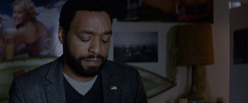 Movie still from “Secret in Their Eyes” (2015), directed by Billy Ray – A person with his eyes closed; Close Up shot, Over the shoulder angle