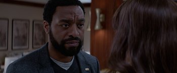 Movie still from “Secret in Their Eyes” (2015), directed by Billy Ray – A person talking to another person; Close Up shot, Over the shoulder angle