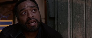 Movie still from “Secret in Their Eyes” (2015), directed by Billy Ray – A person with a beard; Close Up shot, Over the shoulder angle