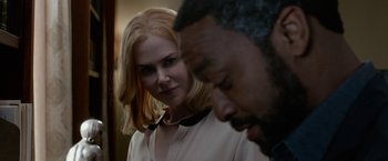 Movie still from “Secret in Their Eyes” (2015), directed by Billy Ray – A woman standing next to a man in front of a building; Close Up shot, Over the shoulder angle