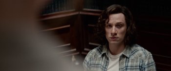 Movie still from “Secret in Their Eyes” (2015), directed by Billy Ray – A man in a plaid shirt is looking at the camera; Close Up shot, Over the shoulder angle