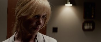 Movie still from “Secret in Their Eyes” (2015), directed by Billy Ray – A person with blonde hair; Close Up shot, Over the shoulder angle