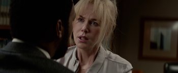 Movie still from “Secret in Their Eyes” (2015), directed by Billy Ray – A woman with blonde hair is looking at a man; Close Up shot, Over the shoulder angle