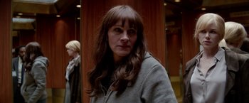 Movie still from “Secret in Their Eyes” (2015), directed by Billy Ray – A person wearing a jacket; Close Up shot, Over the shoulder angle