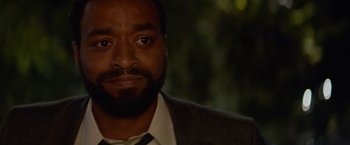 Movie still from “Secret in Their Eyes” (2015), directed by Billy Ray – A person wearing a suit and tie; Close Up shot, Over the shoulder angle