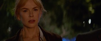 Movie still from “Secret in Their Eyes” (2015), directed by Billy Ray – A person wearing a jacket; Close Up shot, Over the shoulder angle