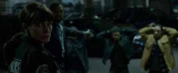 Movie still from “Secret in Their Eyes” (2015), directed by Billy Ray – A group of men standing next to each other; Close Up shot, Over the shoulder angle