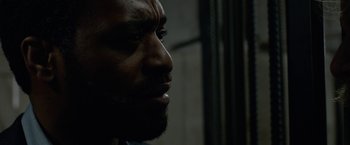 Movie still from “Secret in Their Eyes” (2015), directed by Billy Ray – A person with a beard; Close Up shot, Over the shoulder angle