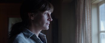 Movie still from “Secret in Their Eyes” (2015), directed by Billy Ray – A person looking out of a window; Close Up shot, Low angle