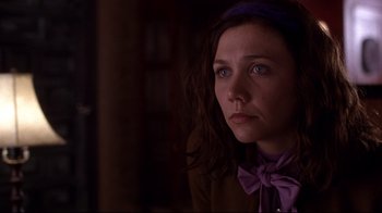 Movie still from “Secretary” (2002), directed by Steven Shainberg – A person wearing a purple bow tie; Close Up shot, Over the shoulder angle