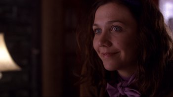 Movie still from “Secretary” (2002), directed by Steven Shainberg – A person wearing a purple shirt; Close Up shot, Over the shoulder angle