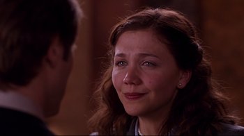 Movie still from “Secretary” (2002), directed by Steven Shainberg – A person looking at a person; Close Up shot, Over the shoulder angle