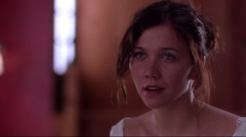 Movie still from “Secretary” (2002), directed by Steven Shainberg – A person wearing a white shirt; Close Up shot, Over the shoulder angle