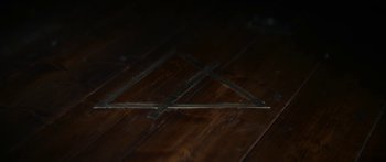Movie still from “1899” (2022), created by Jantje Friese – View of a wooden table; Extreme Close Up shot, Overhead angle