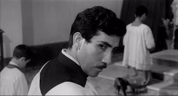 Movie still from “Seduced and Abandoned” (1964), directed by Pietro Germi – A black and white photo of a man with a mustache; Close Up shot, Low angle
