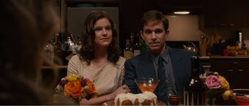 Movie still from “Seeking a Friend for the End of the World” (2012), directed by Lorene Scafaria – A man and a woman sitting in front of a cake; Medium shot, High angle