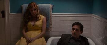 Movie still from “Seeking a Friend for the End of the World” (2012), directed by Lorene Scafaria – A man and a woman sitting in a bath tub in a bathroom; Medium shot, Low angle