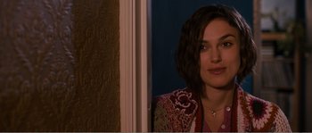 Movie still from “Seeking a Friend for the End of the World” (2012), directed by Lorene Scafaria – A person wearing a jacket near a window; Close Up shot, Over the shoulder angle