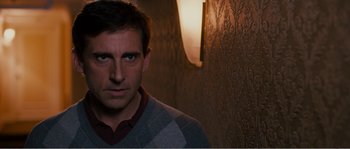 Movie still from “Seeking a Friend for the End of the World” (2012), directed by Lorene Scafaria – A person wearing a sweater; Close Up shot, Over the shoulder angle