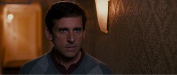 Movie still from “Seeking a Friend for the End of the World” (2012), directed by Lorene Scafaria – A person wearing a sweater; Close Up shot, Over the shoulder angle