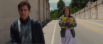 Movie still from “Seeking a Friend for the End of the World” (2012), directed by Lorene Scafaria – Two people standing on the side of the street; Medium shot, Over the shoulder angle