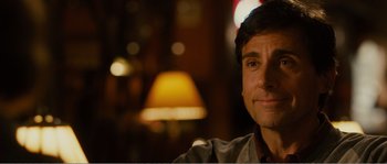 Movie still from “Seeking a Friend for the End of the World” (2012), directed by Lorene Scafaria – A person sitting in front of a lamp; Close Up shot, Over the shoulder angle