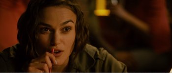 Movie still from “Seeking a Friend for the End of the World” (2012), directed by Lorene Scafaria – A person sitting down with a cell phone; Close Up shot, Over the shoulder angle