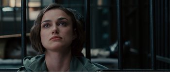 Movie still from “Seeking a Friend for the End of the World” (2012), directed by Lorene Scafaria – A person sitting in a chair; Close Up shot, Over the shoulder angle