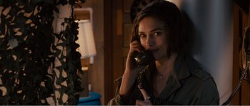 Movie still from “Seeking a Friend for the End of the World” (2012), directed by Lorene Scafaria – A woman talking on a phone in a room; Close Up shot, Over the shoulder angle
