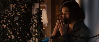 Movie still from “Seeking a Friend for the End of the World” (2012), directed by Lorene Scafaria – A woman holding her hands to her face; Close Up shot, Over the shoulder angle