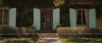 Movie still from “Seeking a Friend for the End of the World” (2012), directed by Lorene Scafaria – A man standing in front of an open door; Wide shot, Low angle