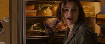Movie still from “Seeking a Friend for the End of the World” (2012), directed by Lorene Scafaria – A person in front of a refrigerator; Close Up shot, Over the shoulder angle