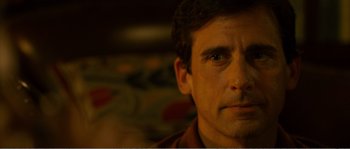 Movie still from “Seeking a Friend for the End of the World” (2012), directed by Lorene Scafaria – A man's face in the dark; Close Up shot, Over the shoulder angle