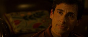 Movie still from “Seeking a Friend for the End of the World” (2012), directed by Lorene Scafaria – A man's face in the dark; Close Up shot, Over the shoulder angle