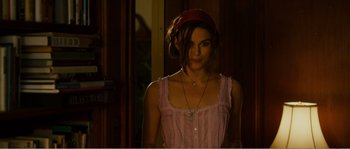 Movie still from “Seeking a Friend for the End of the World” (2012), directed by Lorene Scafaria – A woman in a pink dress and a red headband; Medium shot, Over the shoulder angle